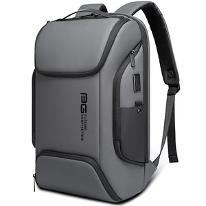 Grey waterproof travel backpack with front zipper pocket and padded shoulder strap