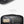 Black laptop sleeve interior organizer pocket with zip divider and pen sleeves.