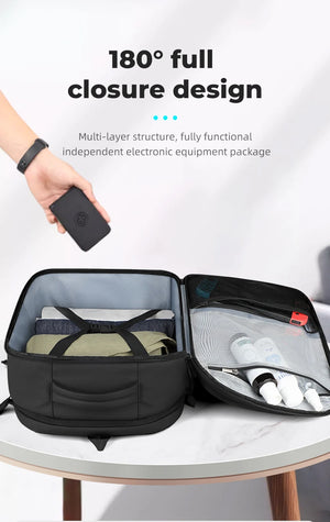 Black backpack with 180° full-closure opening showing interior organizer compartments