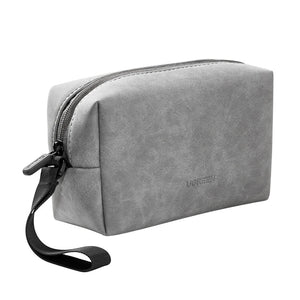 Grey toiletry bag with black strap on a white background, featuring the brand 'UGREEN'.