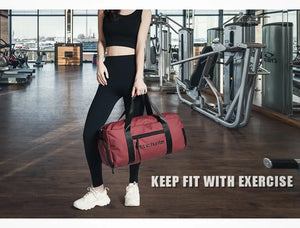 Waterproof duffel bag in red with zippered front panel and shoulder strap
