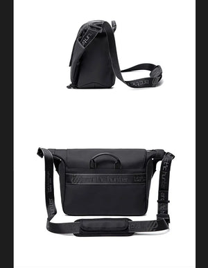 Black compact crossbody bag with flap closure and adjustable strap, front and back