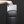 Dark gray compact waterproof crossbody bag with top carry handle and front zipper