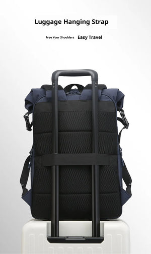 Navy roll-top travel backpack with luggage hanging strap on front view