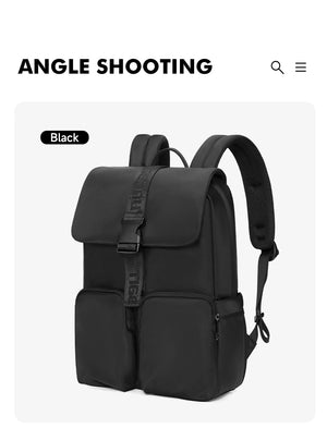 Black compact commuter backpack with top flap pocket, dual handles, and front zipper