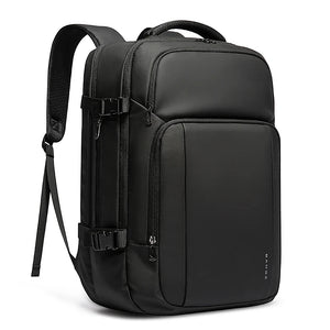 Black laptop travel backpack with front zipper pocket, adjustable shoulder straps, and side panel.