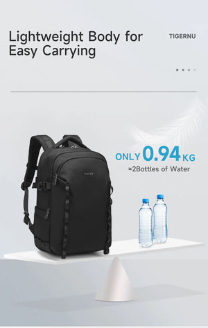 Lightweight black waterproof backpack with carry handle and slim front profile