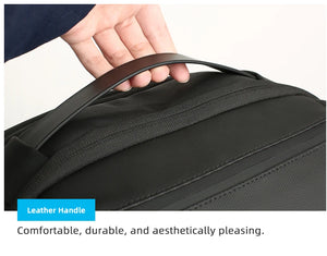 Dark textured backpack with padded top handle and stitched side panel detail