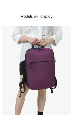 Purple backpack worn by a model with side zipper pocket and shoulder straps