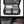 Black travel backpack open view with laptop sleeve and organized interior pockets