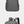 Grey compact backpack with top handle, front zipper pocket, and side details
