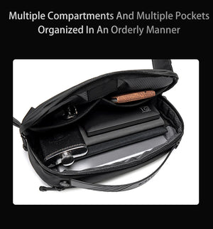 Black crossbody bag open showing multiple internal compartments and pockets