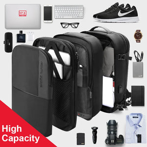Black waterproof travel backpack with front compartments and side carry straps