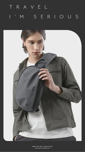 Black sling bag with top handle, adjustable strap, and zippered main compartment