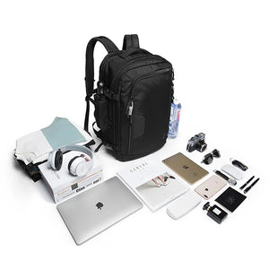 Black expandable travel backpack with multiple front compartments and straps