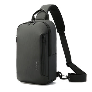 Lightweight waterproof crossbody bag, dark gray, top handle and adjustable shoulder strap.