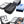 Black vacuum compression travel backpack shown with folded clothes inside compression sections
