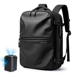 Black waterproof travel backpack with pump, front pocket and adjustable shoulder strap.