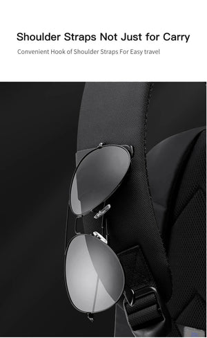 Black backpack with textured shoulder strap and adjustable buckle hardware