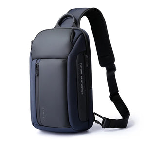 Blue compact waterproof crossbody bag with front zip pocket and adjustable shoulder strap