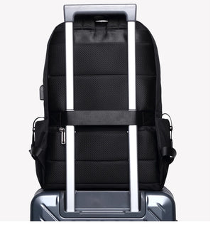 Black commuter backpack back view with trolley sleeve strap