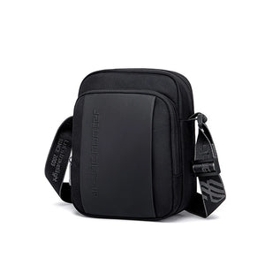 Black compact messenger bag with front zip panel and adjustable shoulder strap