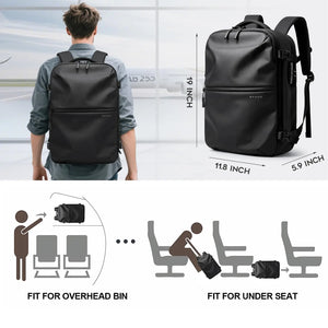Black vacuum compression travel backpack, back view with shoulder straps and buckles