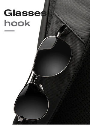 Black backpack with glasses hook inside a front accessory pocket