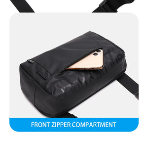 Black crossbody bag with front zipper compartment and slim interior for tablet