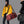 Red waterproof duffle bag with shoulder strap and front zip pocket