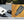 Yellow backpack close-up of built-in USB charging port with connected power cable