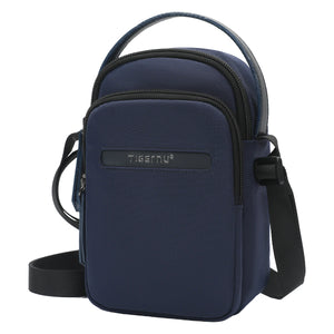 Navy compact crossbody bag with front zipper pocket and adjustable shoulder strap