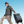 Grey roll-top travel backpack carried on side with front flap and adjustable straps