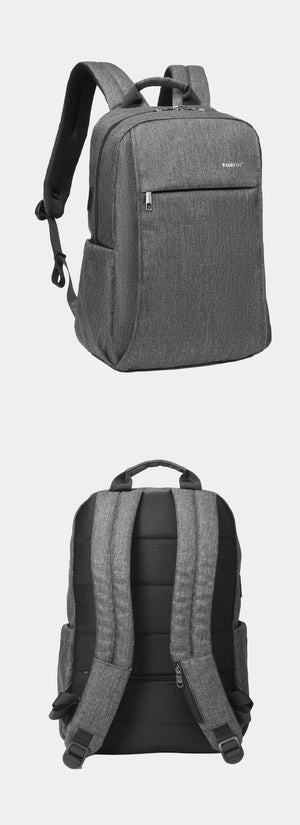 Grey compact backpack with adjustable shoulder straps and padded rear back panel
