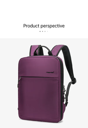 Purple compact waterproof backpack front view with top handle and zippered pocket