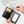 Black bifold wallet open, card slots and dedicated cash compartment.