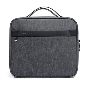 Gray collapsible waterproof toiletries bag front with top handle and zip pocket panel