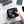 Open black tech storage bag with compartments for devices and accessories