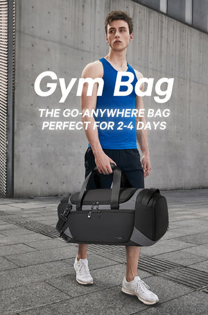 Black duffle bag worn crossbody by a person