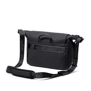Black compact waterproof crossbody bag with flap and adjustable shoulder strap
