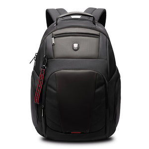 Black waterproof travel backpack with front zip pocket and padded shoulder straps