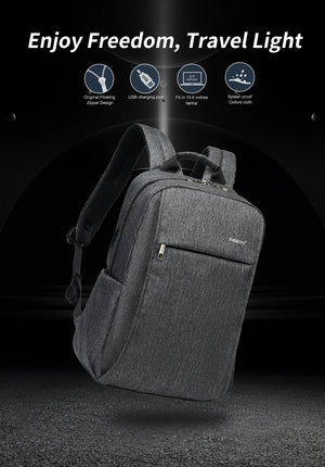 Grey compact backpack with padded shoulder straps and front zip pocket