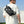 Black crossbody bag worn crossbody on back with BANGE logo on rear panel.