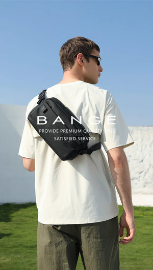 Black crossbody bag worn crossbody on back with BANGE logo on rear panel.