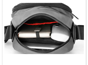 Open black messenger bag showing organizer slots and zippered top opening
