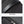 Black waterproof duffle bag close-up of zipper pulls and textured fabric panel