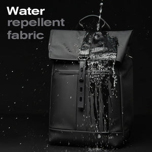 Black waterproof travel backpack front with water splash on the top flap and vertical zipper.