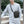 Black crossbody messenger bag worn on chest with adjustable shoulder strap