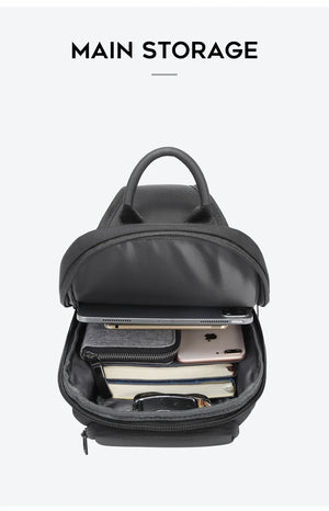 Dark gray compact waterproof crossbody bag open to show inner compartments and zip pocket