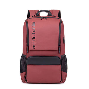 Red backpack with black accents and 'arctic hunter' branding on a white background